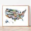 Framed map of the United States with scenic images on a white wall.