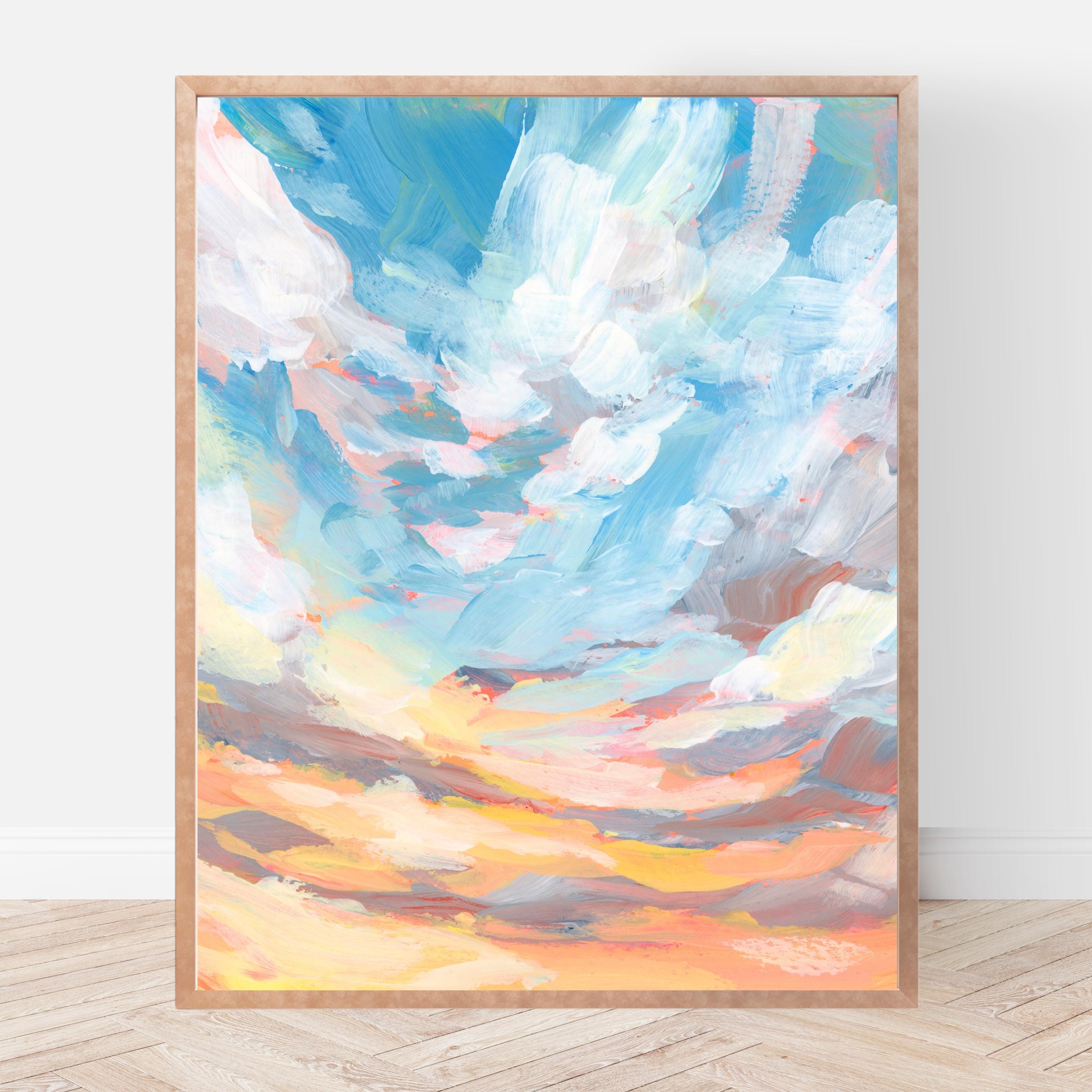 Colorful abstract painting of a sunset sky in a wooden frame on a white wall.