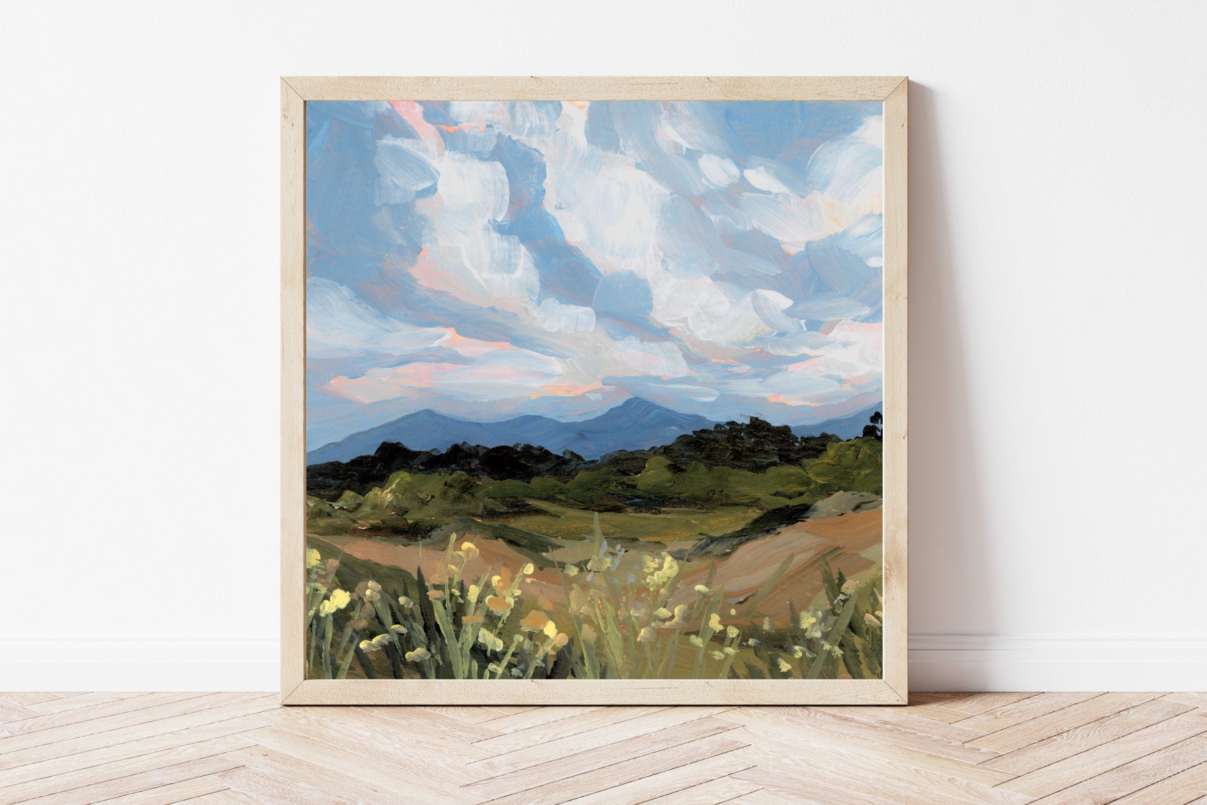 Framed print of a Colorado Springs mountain landscape, against a white wall. 
