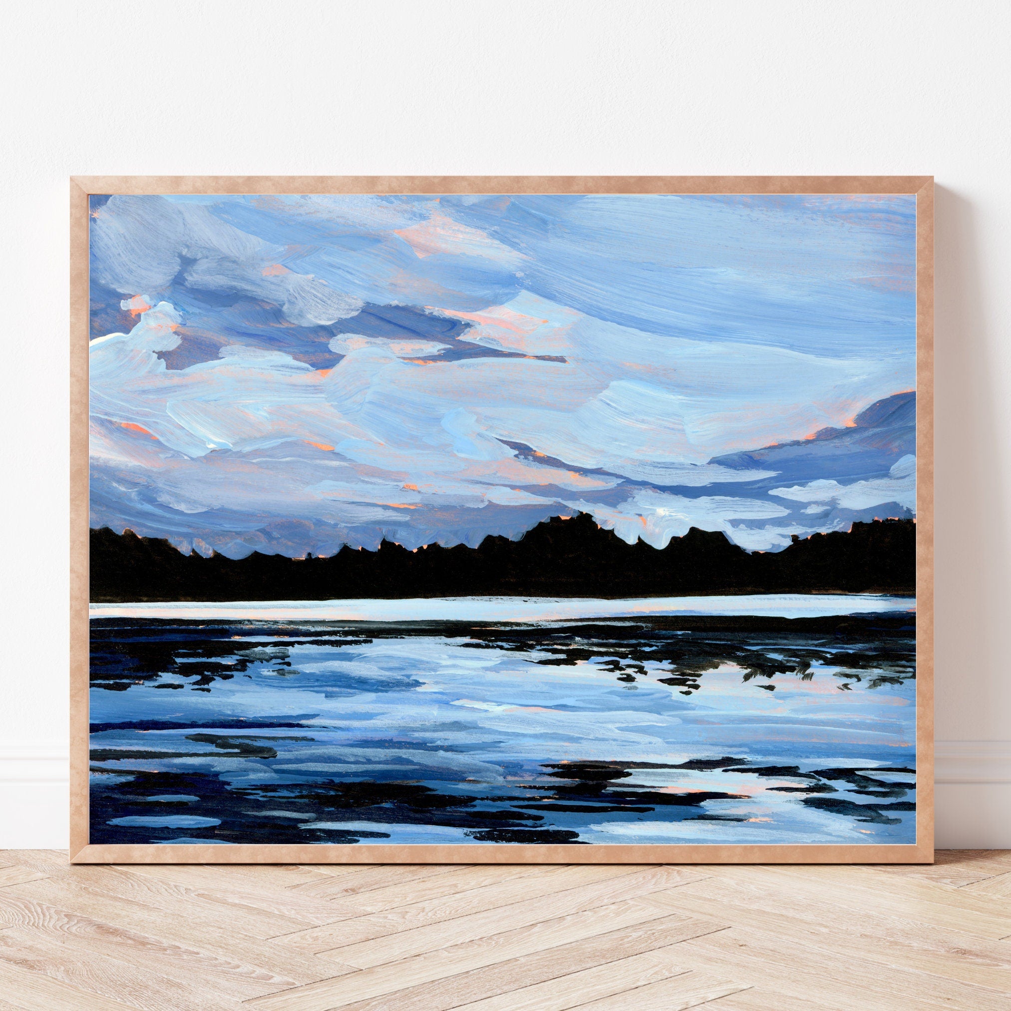 A framed art print of the blue sky reflecting over Lake Ontario. 