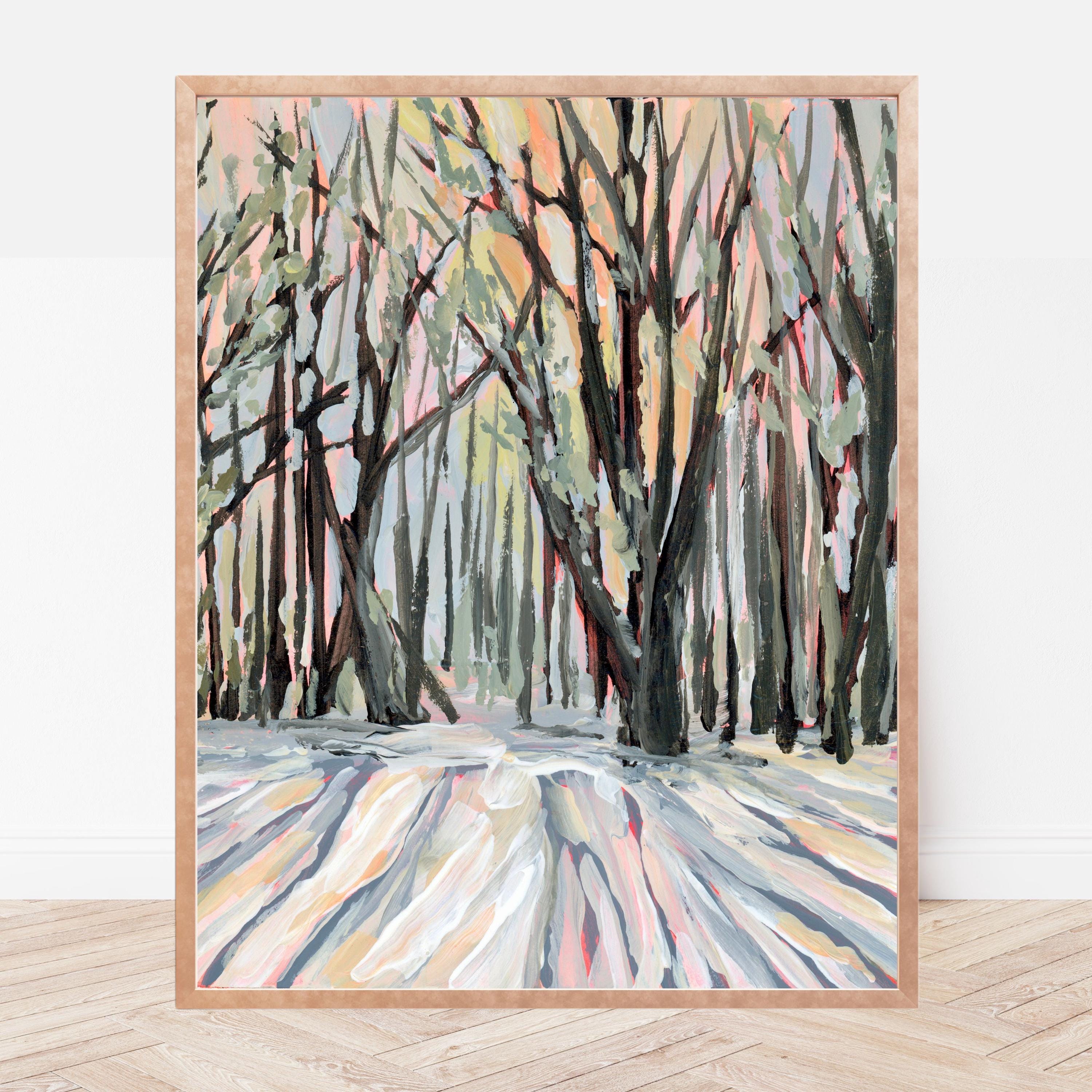 Framed artwork of a winter forest scene with abstract brushstrokes on a white wall.