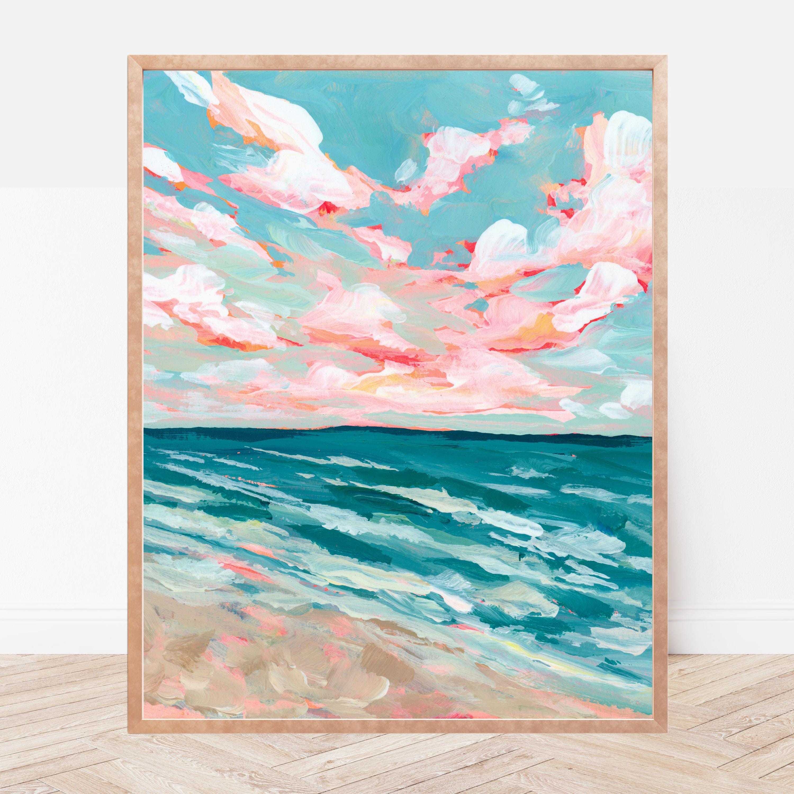 Framed artwork of a colorful sky with bold clouds over the ocean.